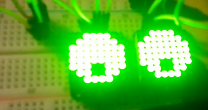 Google eyes... but matrix style "two led matrices with green lights illustrating eyes"