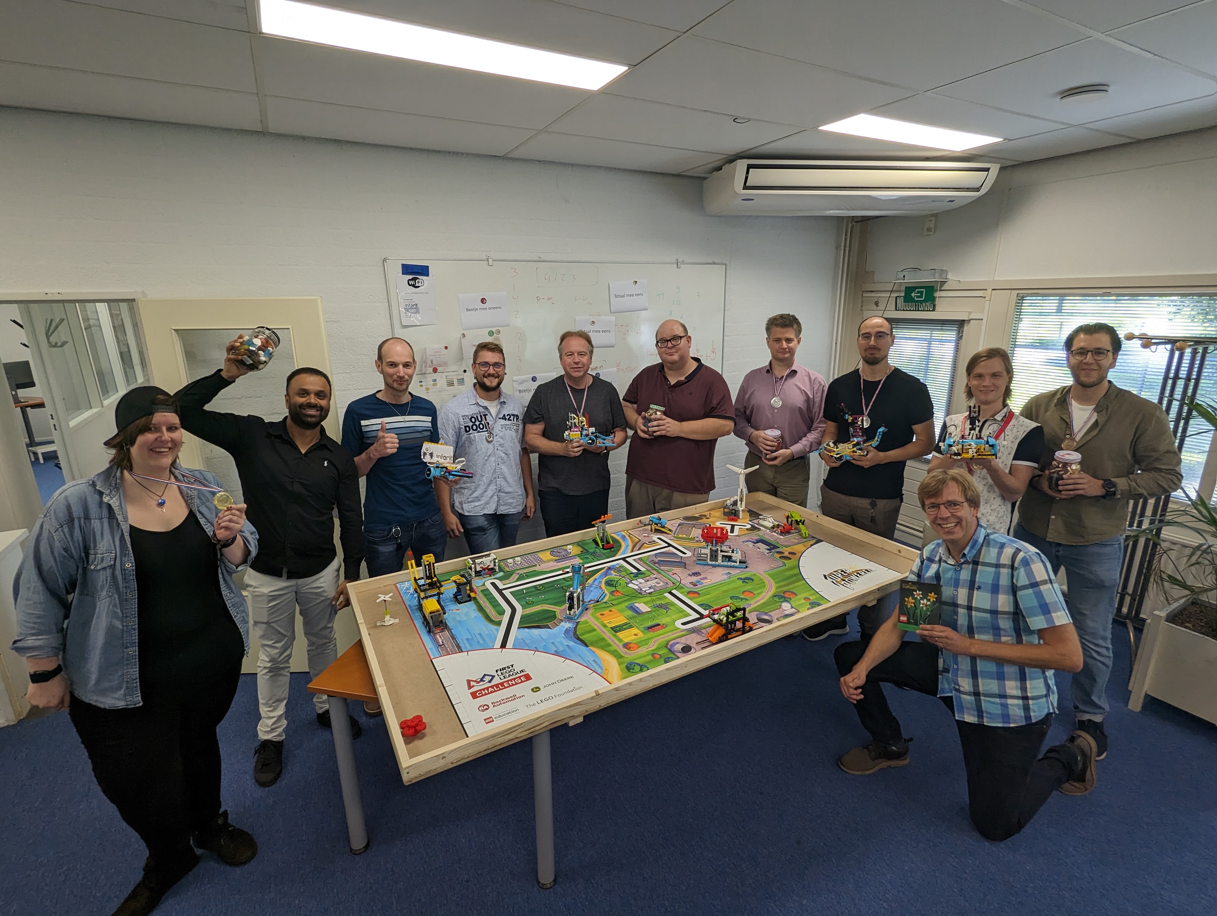 All of our winners! (excluding myself 😢) a group picture of all the contestants, some wearing their medals and carrying their candy prize