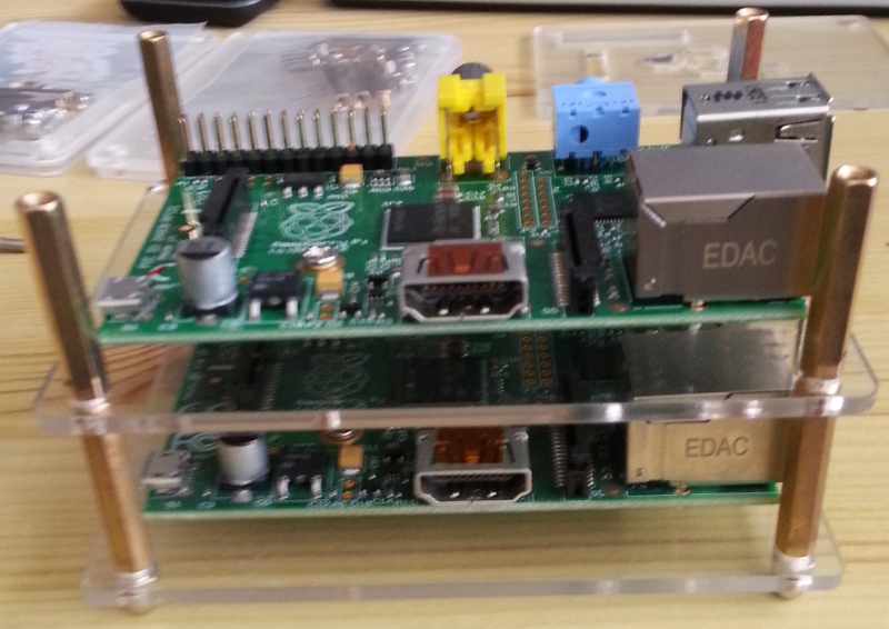 rising up! 2 raspberry pis stacked in their cases